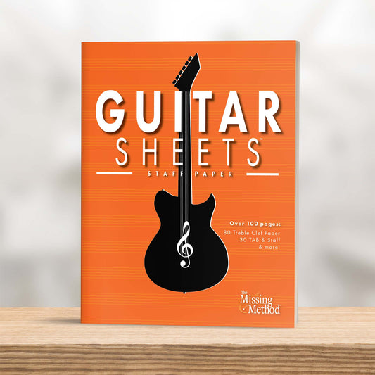 Guitar Sheets Staff Paper, Paperback book from The Missing Method for Guitar, displayed on shelf