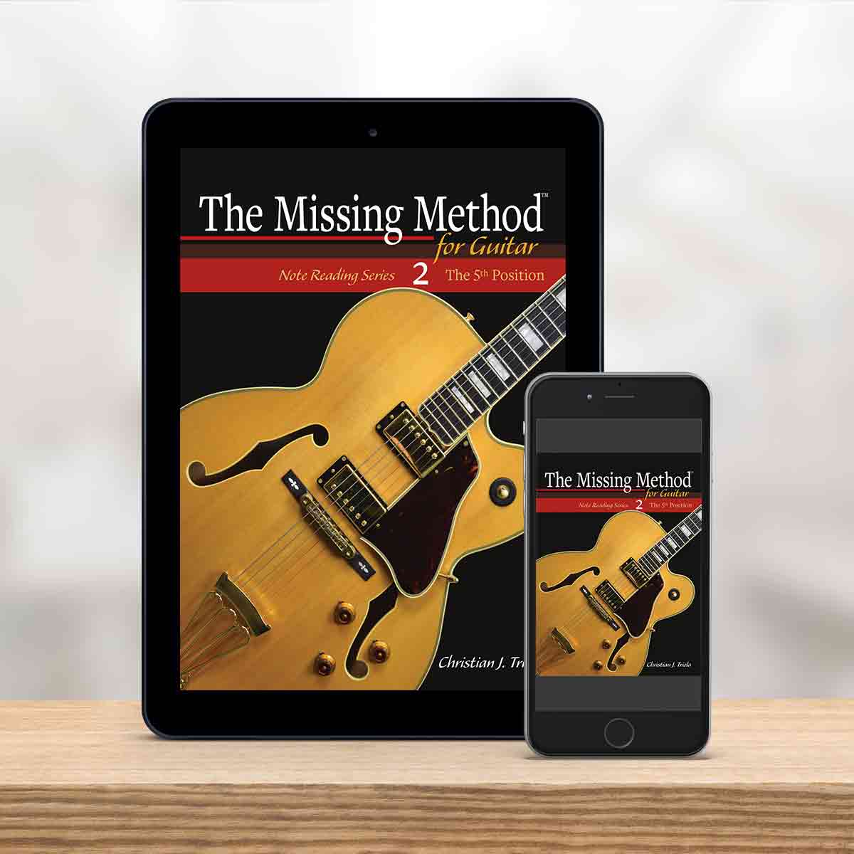 Digital Tablet and smartphone showing the cover of The Missing Method for Guitar Note Reading Series Book 2 by Christian Triola
