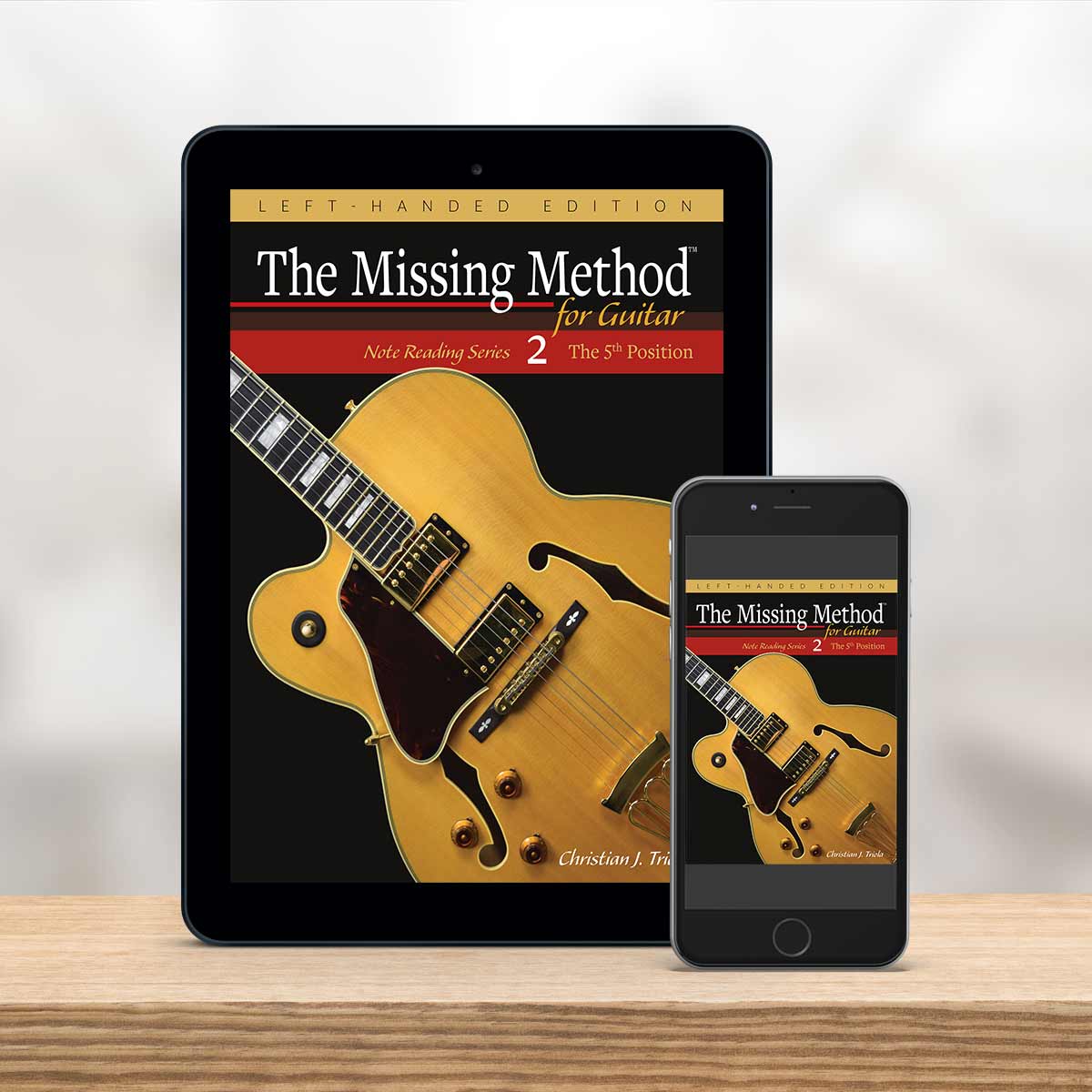 Digital Tablet and smartphone showing the cover of The Missing Method for Guitar Note Reading Series Book 2, Left-Handed Edition by Christian Triola