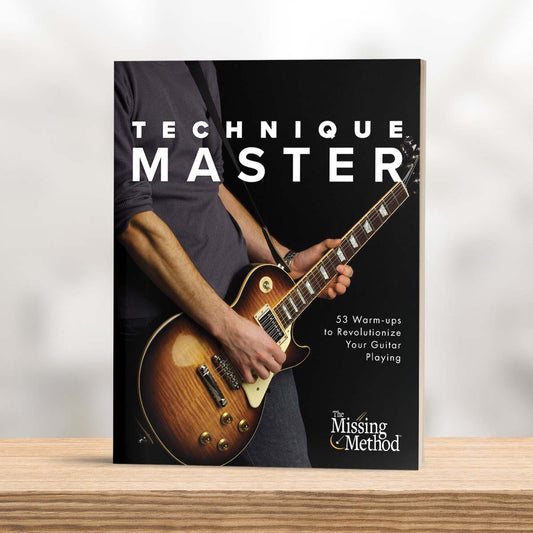 Technique Master from The Missing Method for Guitar. Image of book on table, displaying the front cover.